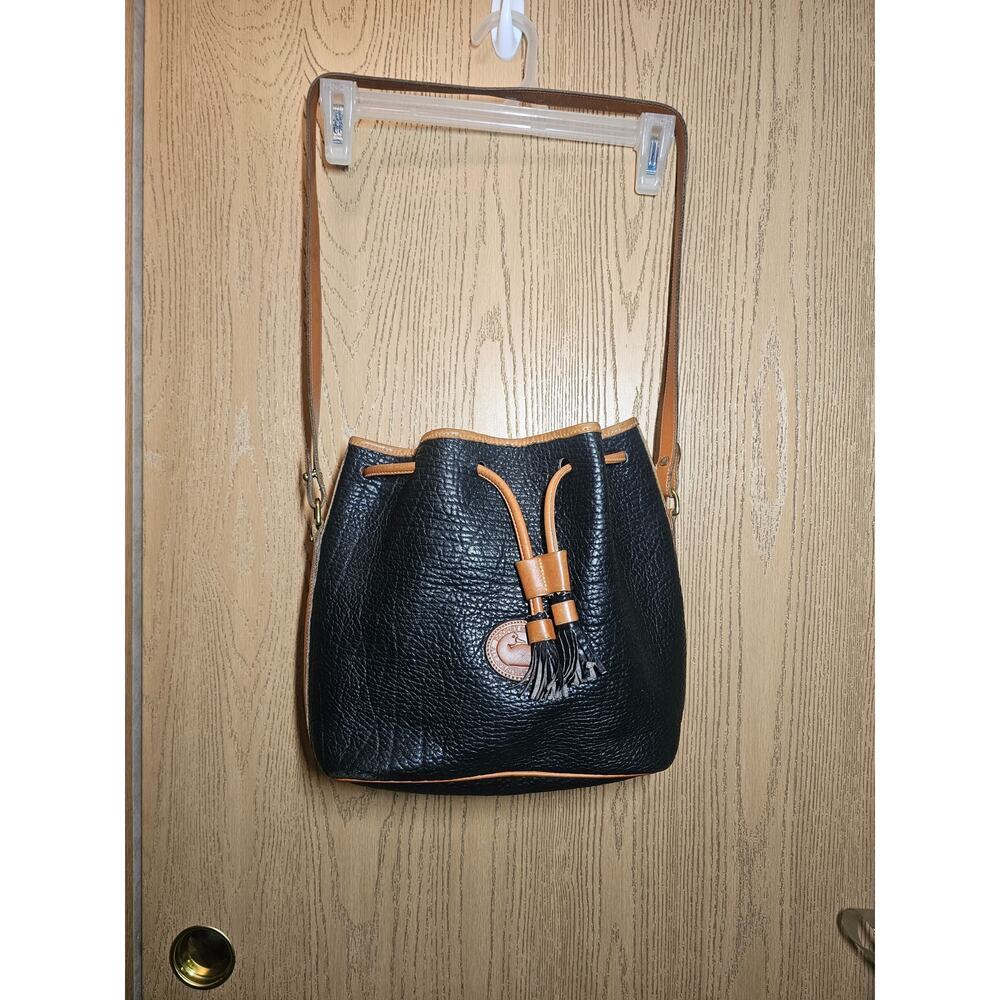 Vintage black and brown Dooney and Bourke bucket style bag. Gently used